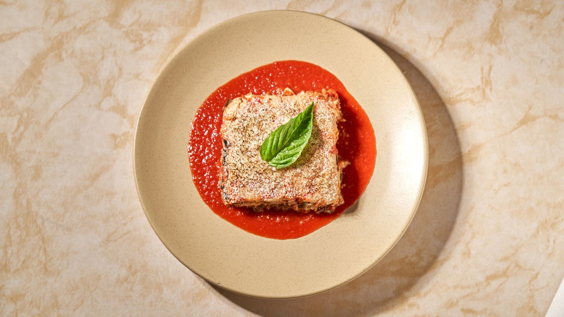 Eggplant parmigiana with tomato sauce and basil – photo by Willians Huerta, Pexels