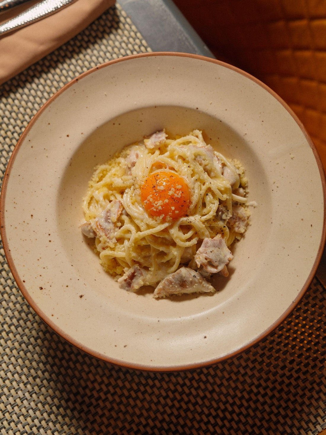 Carbonara with a fresh egg yolk on top – photo by Nadin Sh, Pexels