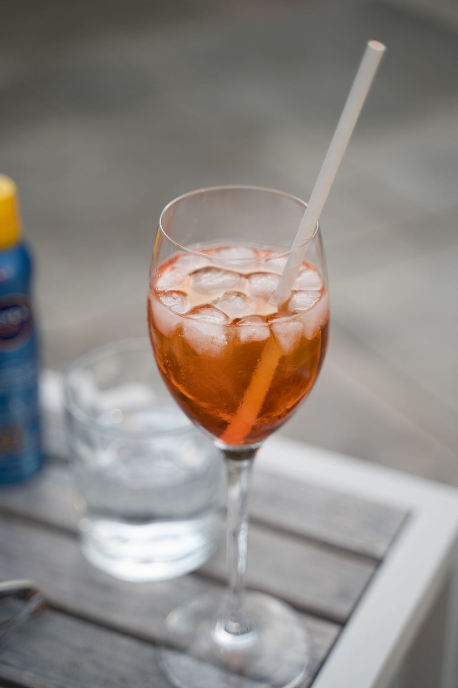 Chilled bitter cocktail with ice and straw outdoors – photo by VAAN PHOTOGRAPHY, Pexels