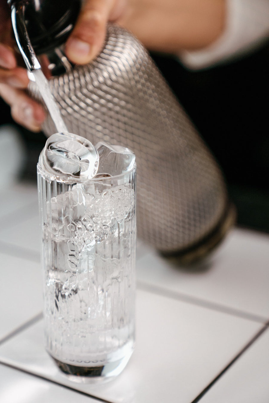 Sparkling soda poured over ice cubes – photo by Dimenshteyn, Pexels